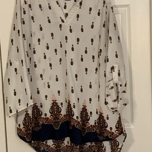 Tunic length high low hem cream and navy blouse with adjustable sleeves